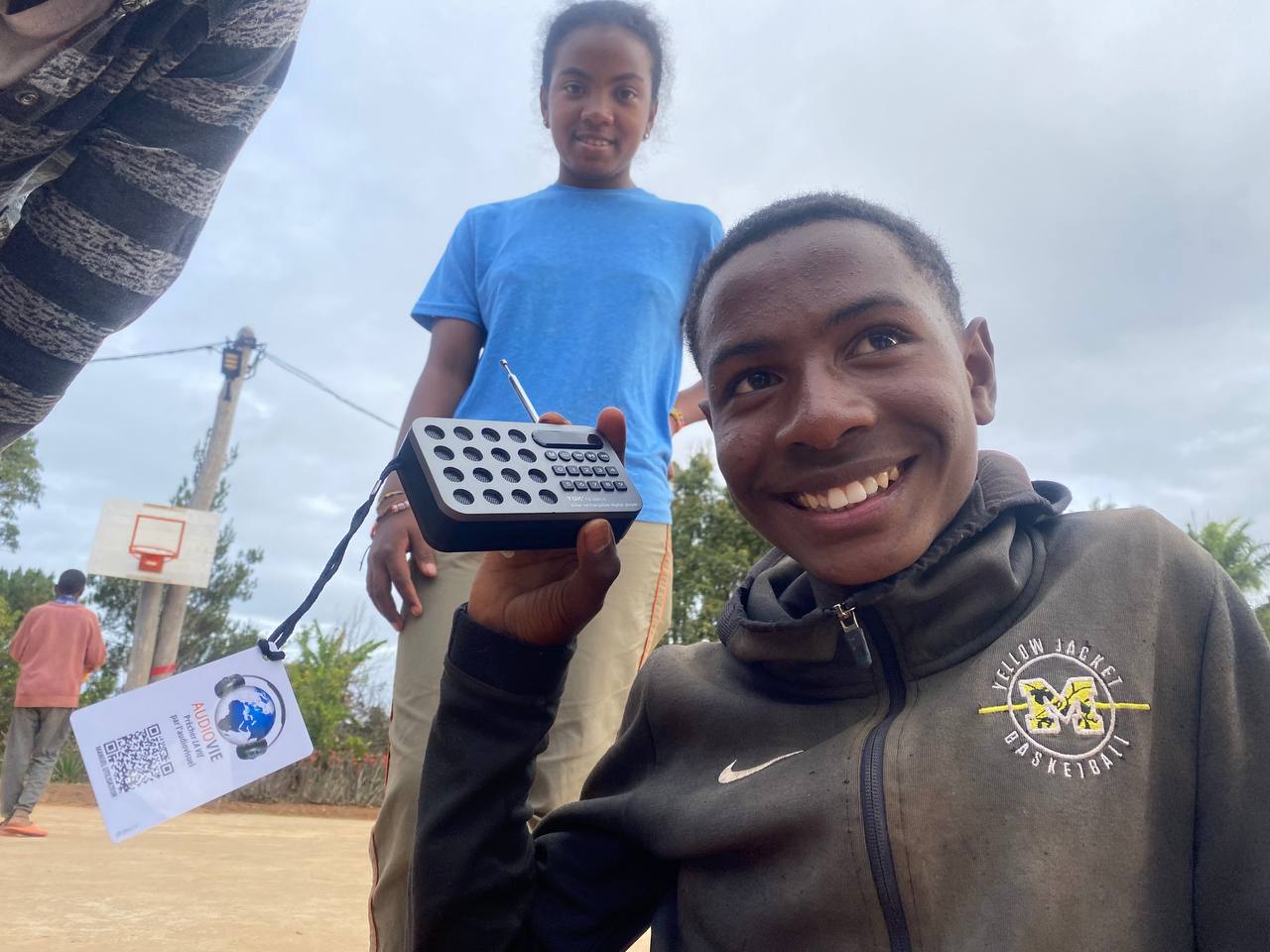 Listening — a young man with his Audio Vie player, Madagascar.